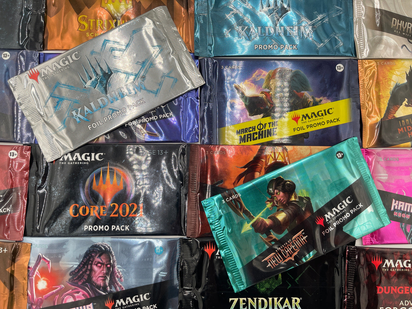 Collection of Magic: The Gathering trading card packs on a reflective surface